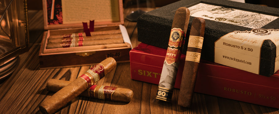 Cigars and packaging on a wooden surface