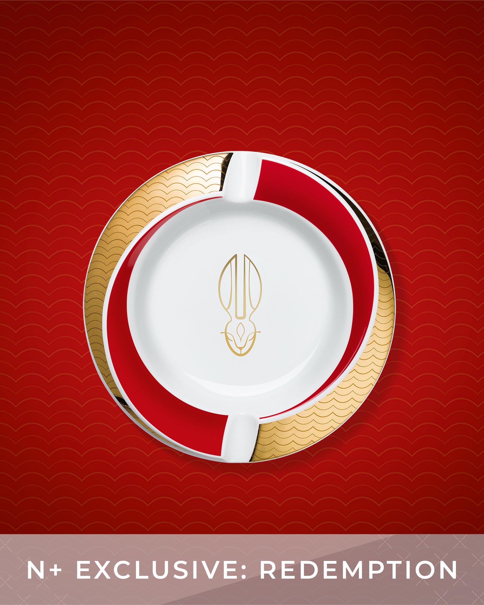Decorative plate with gold and red design on a red background
