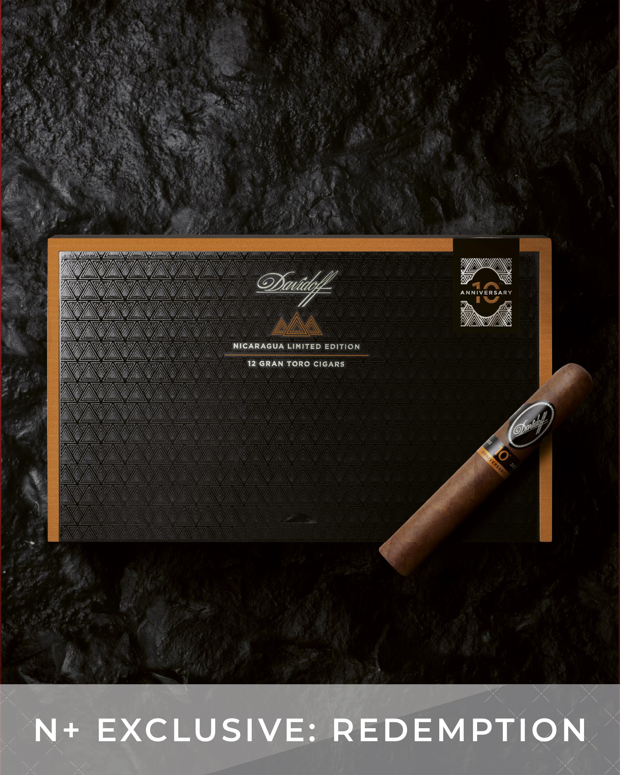 Cigar box with a cigar on a dark textured background