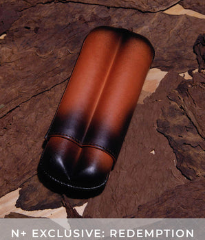 Brown leather case on a textured brown background with 'N+ Exclusive: Redemption' text.
