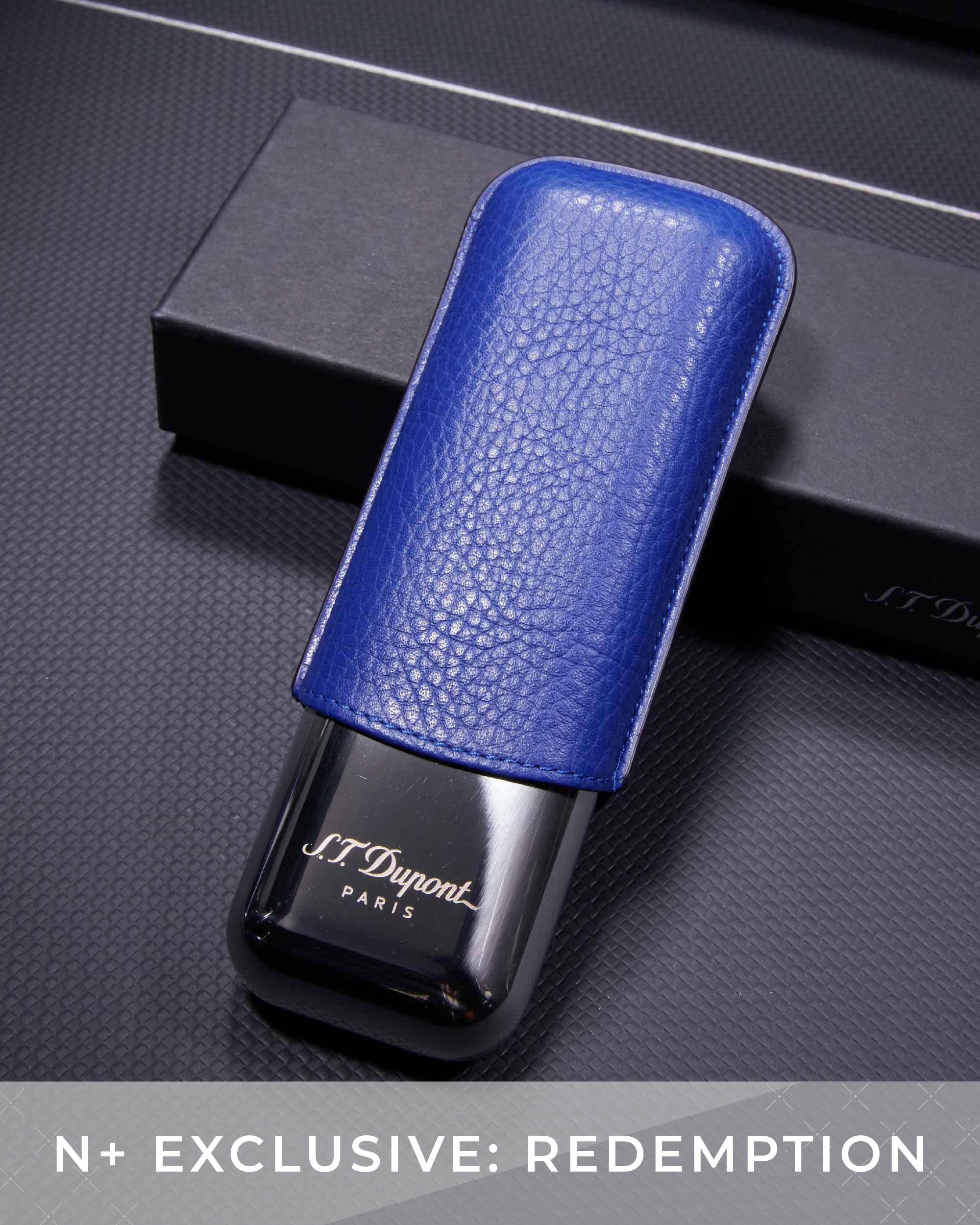 Blue leather case with black device featuring 'J.T. Dupont' branding on a dark textured surface.