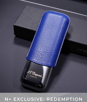 Blue leather case with black device featuring 'J.T. Dupont' branding on a dark textured surface.