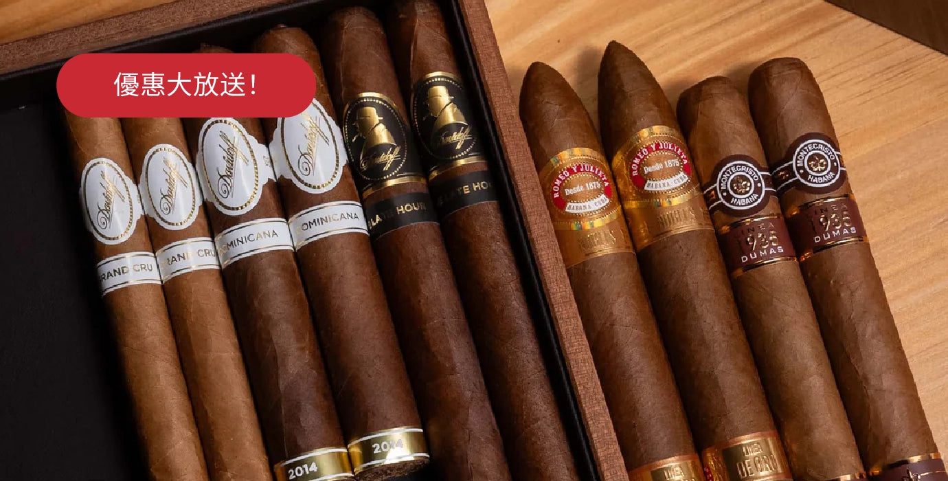 Assorted cigars with visible brand labels in a wooden humidor.