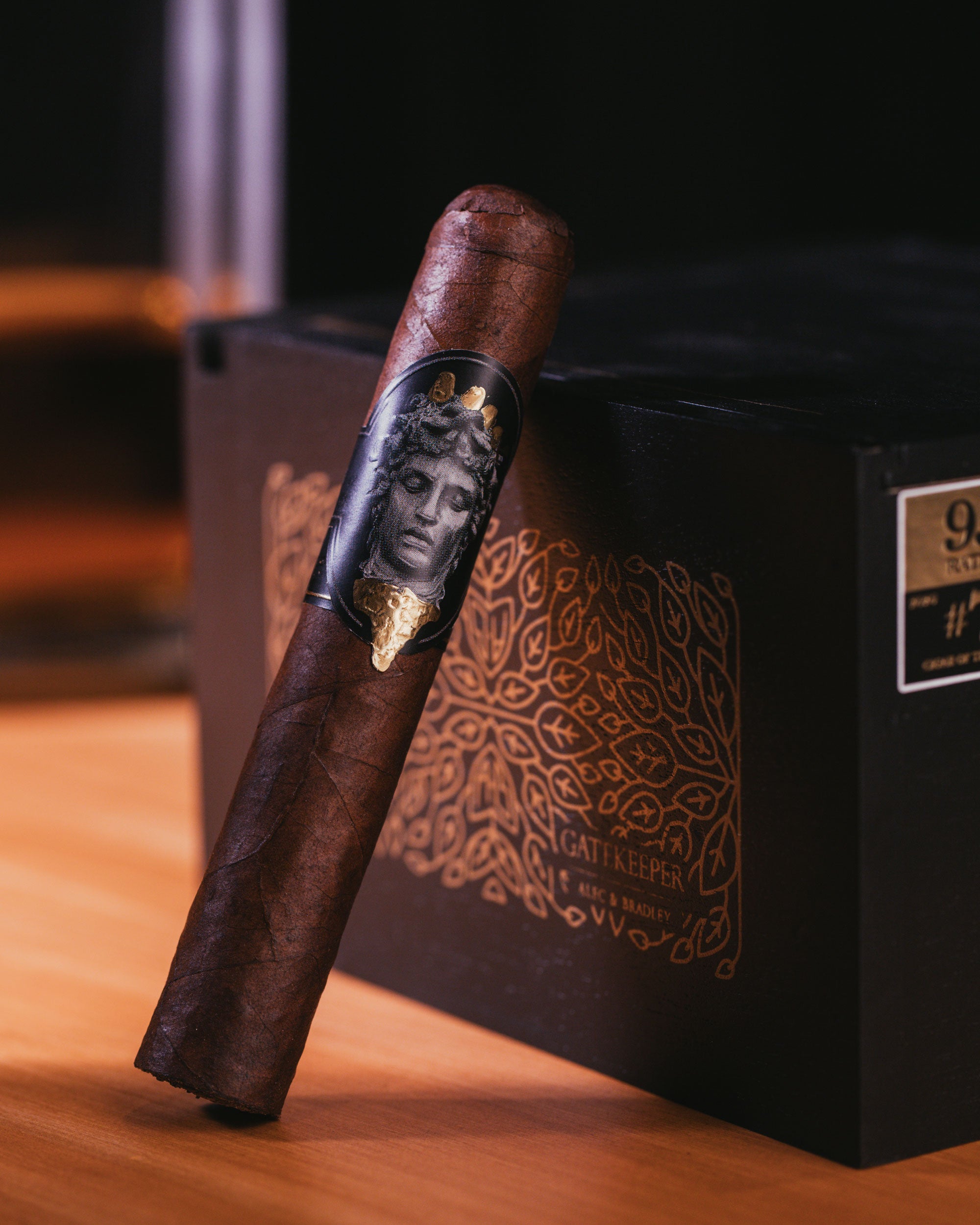 Cigar with a decorative label on a wooden surface