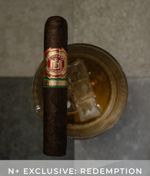 Cigar with a brand label on a gray background