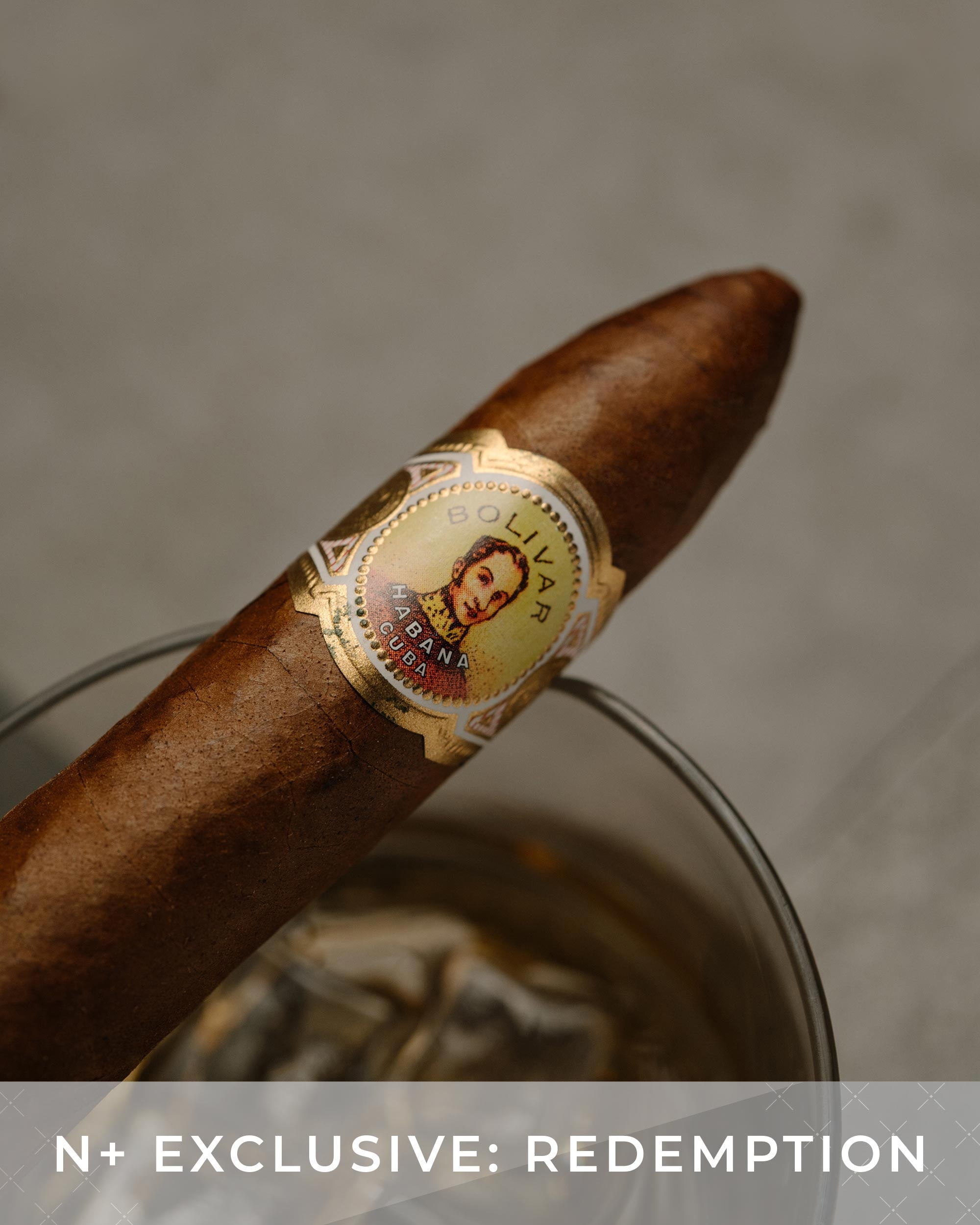 Cigar with a label on a gray background