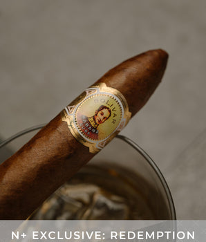 Cigar with a label on a gray background