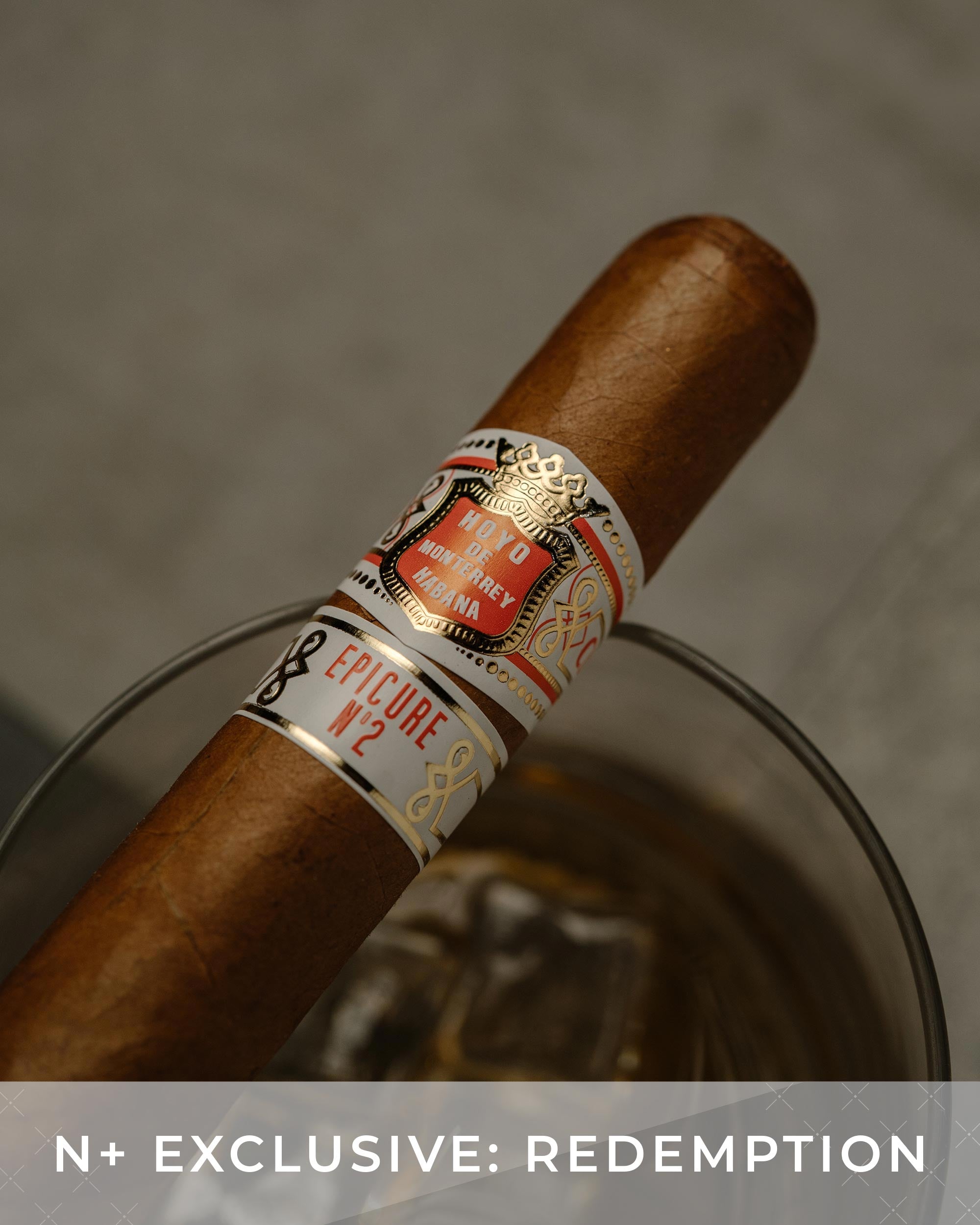 Cigar with a visible label on a gray background