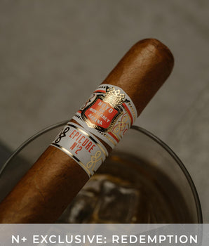 Cigar with a visible label on a gray background