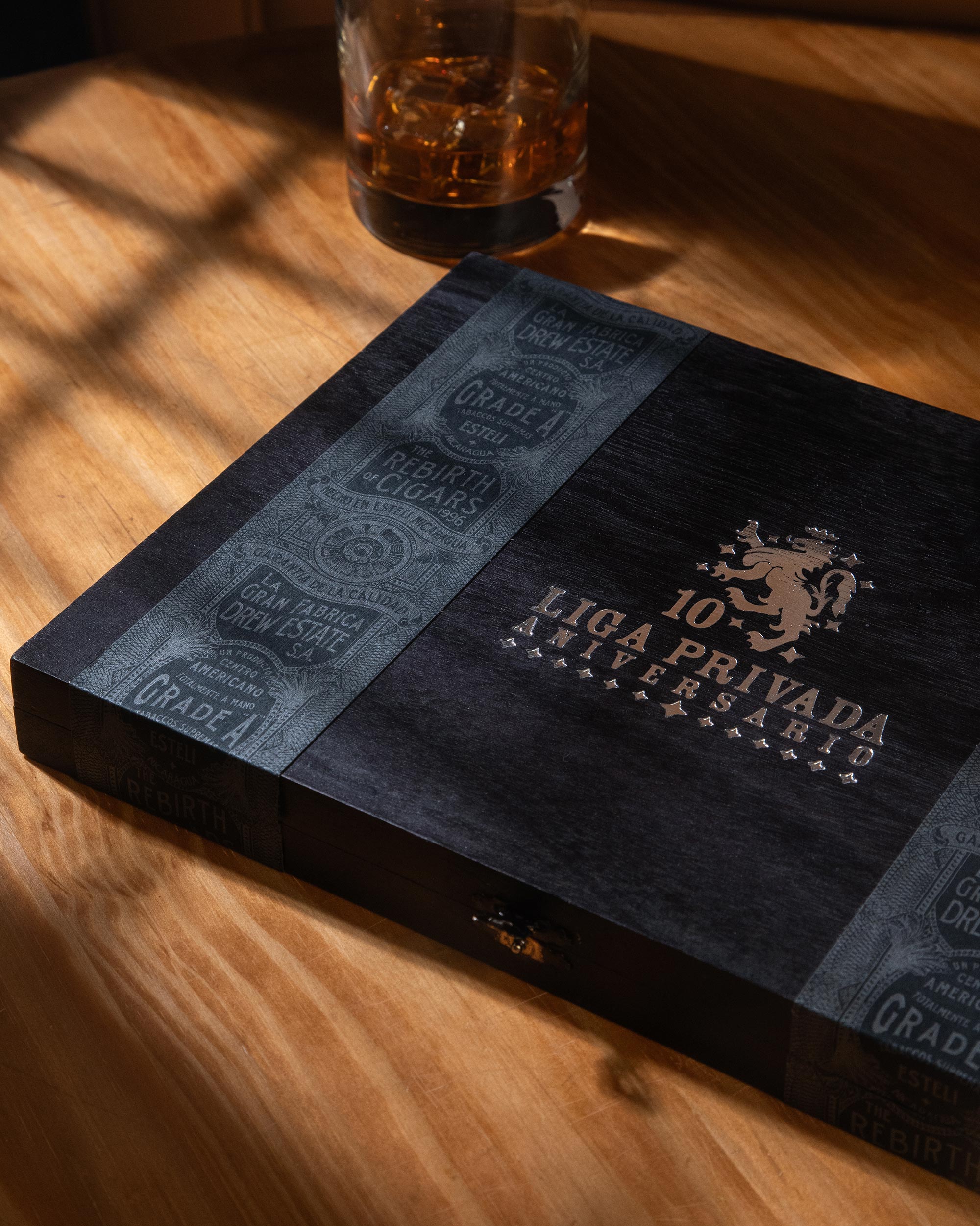 Cigar box with Liga Privada branding on a wooden surface