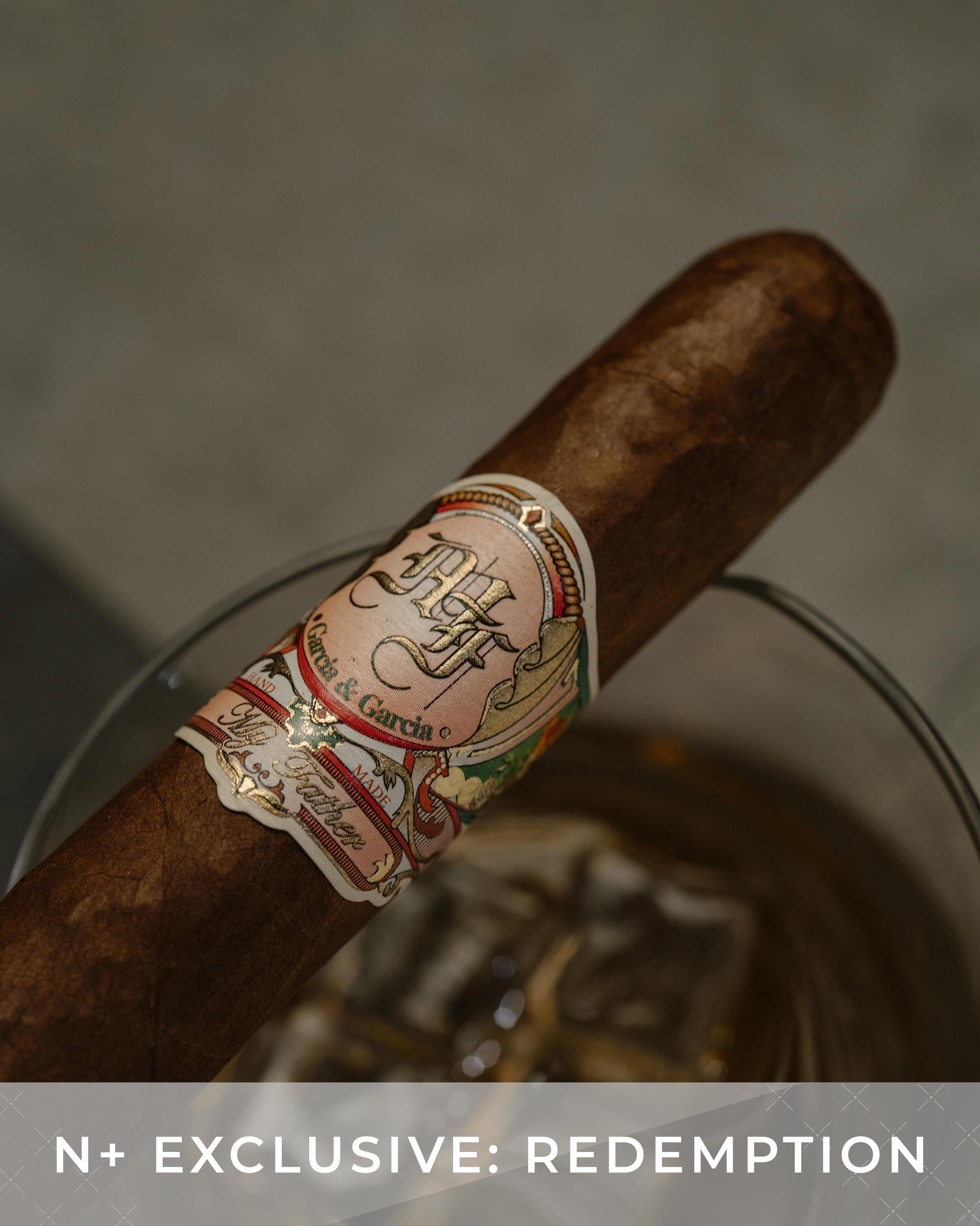 Cigar with a label on a reflective surface, featuring the text 'N+ Exclusive: Redemption'.