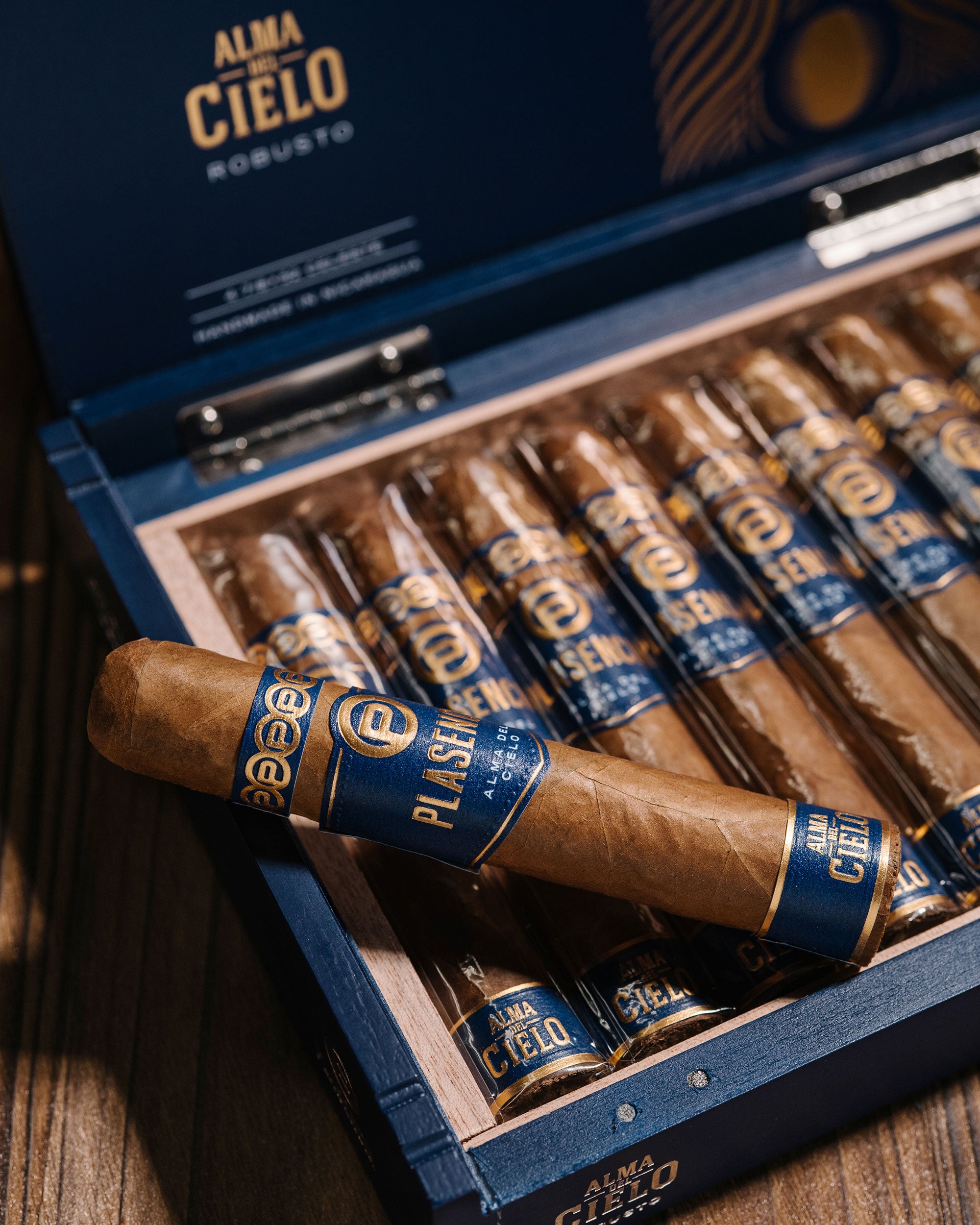 Open box of Alma de Cielo cigars with cigars displayed.