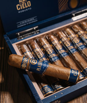 Open box of Alma de Cielo cigars with cigars displayed.