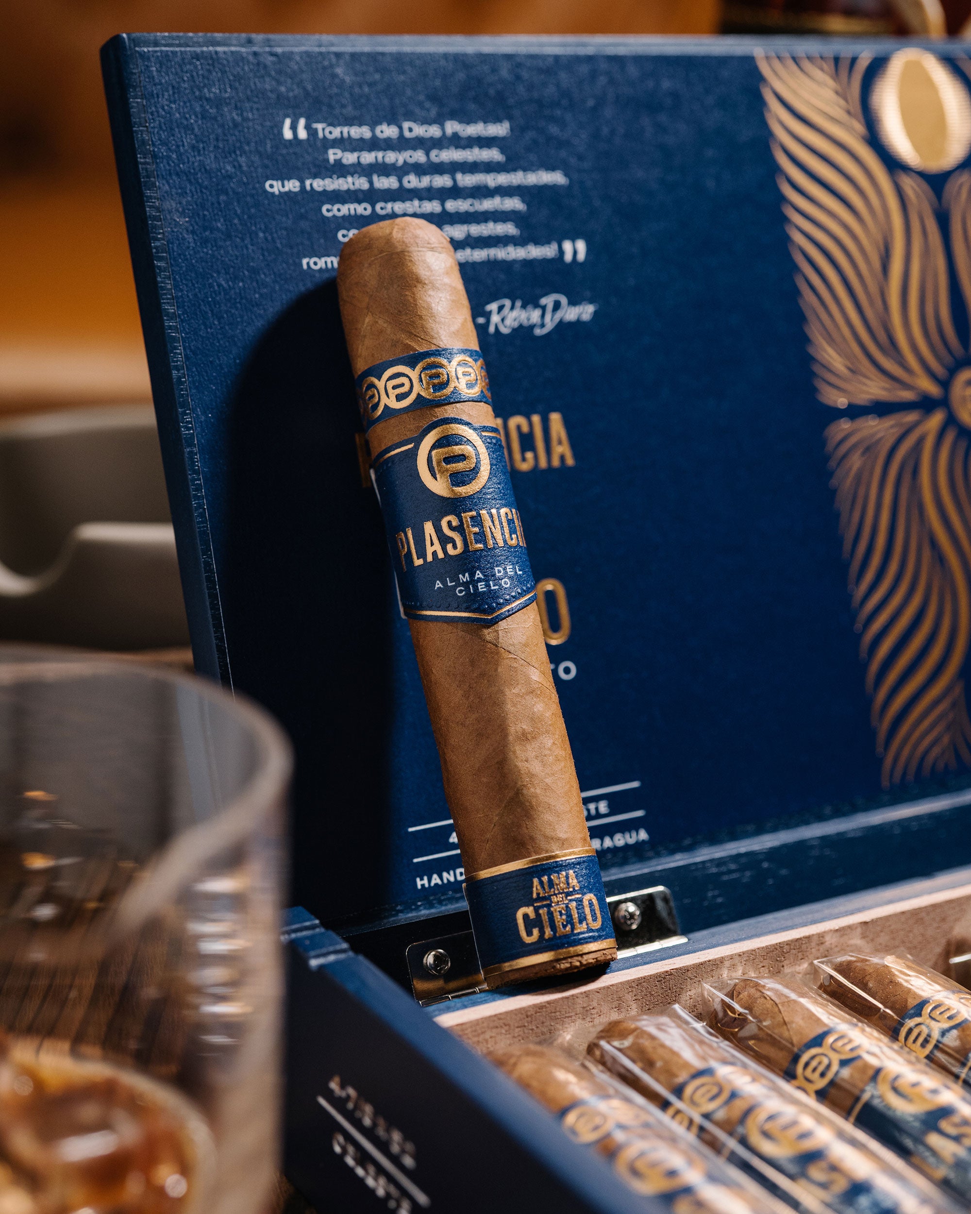 Cigar in a humidor with a blue box featuring gold text