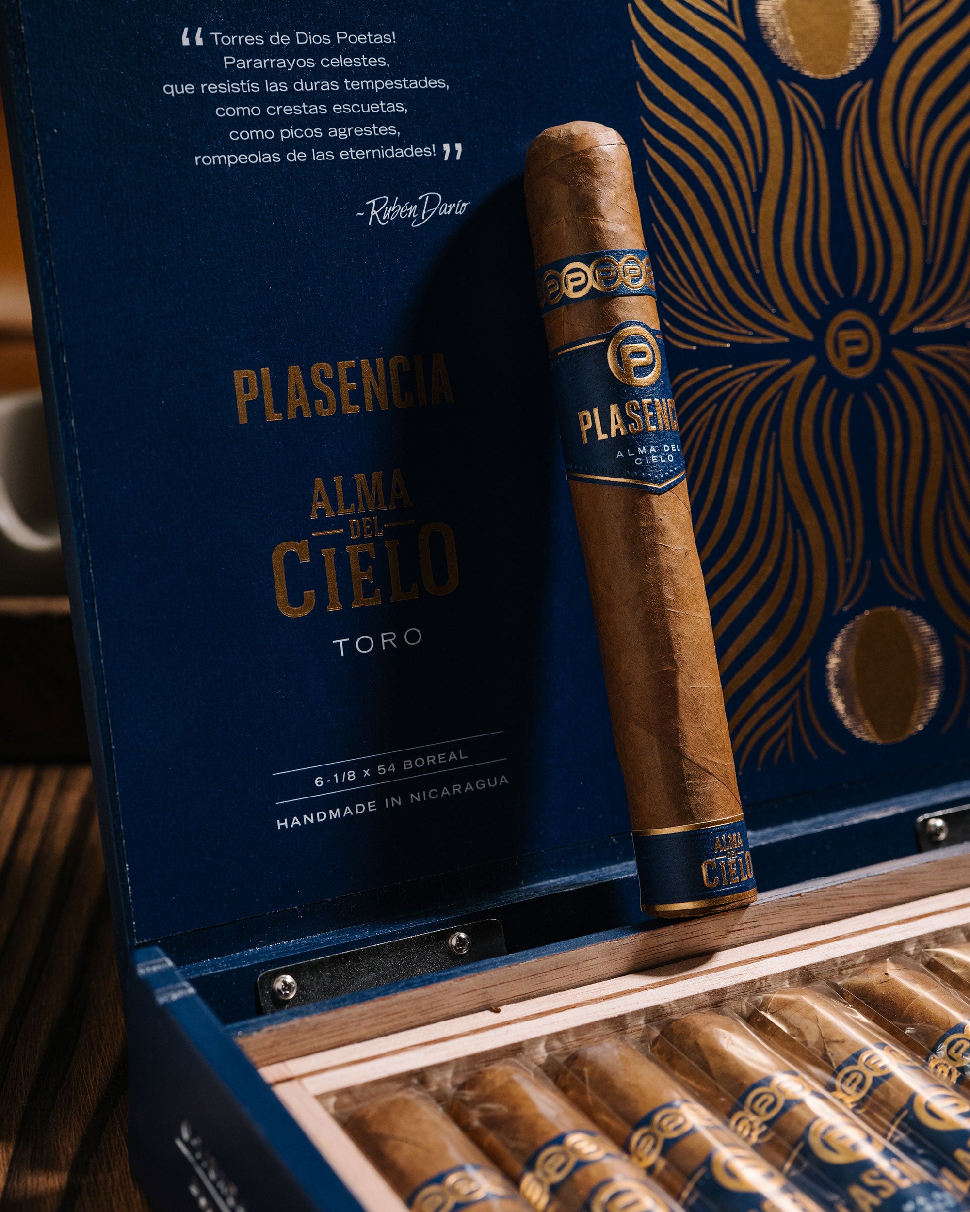 Plasencia Alma de Cielo Toro cigar with packaging in a wooden humidor.