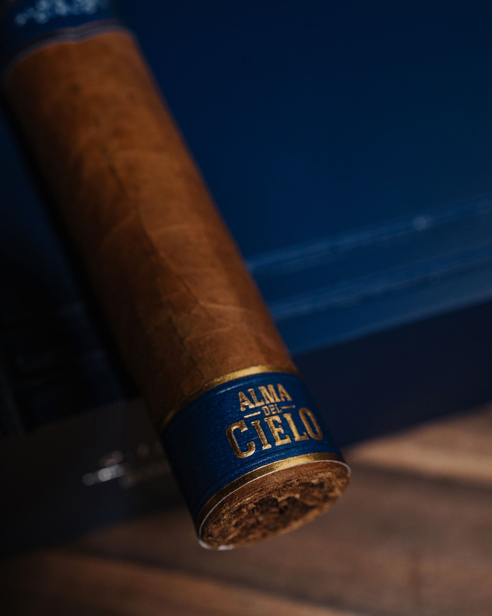 Cigar with 'Alma Cielo' label on a dark background