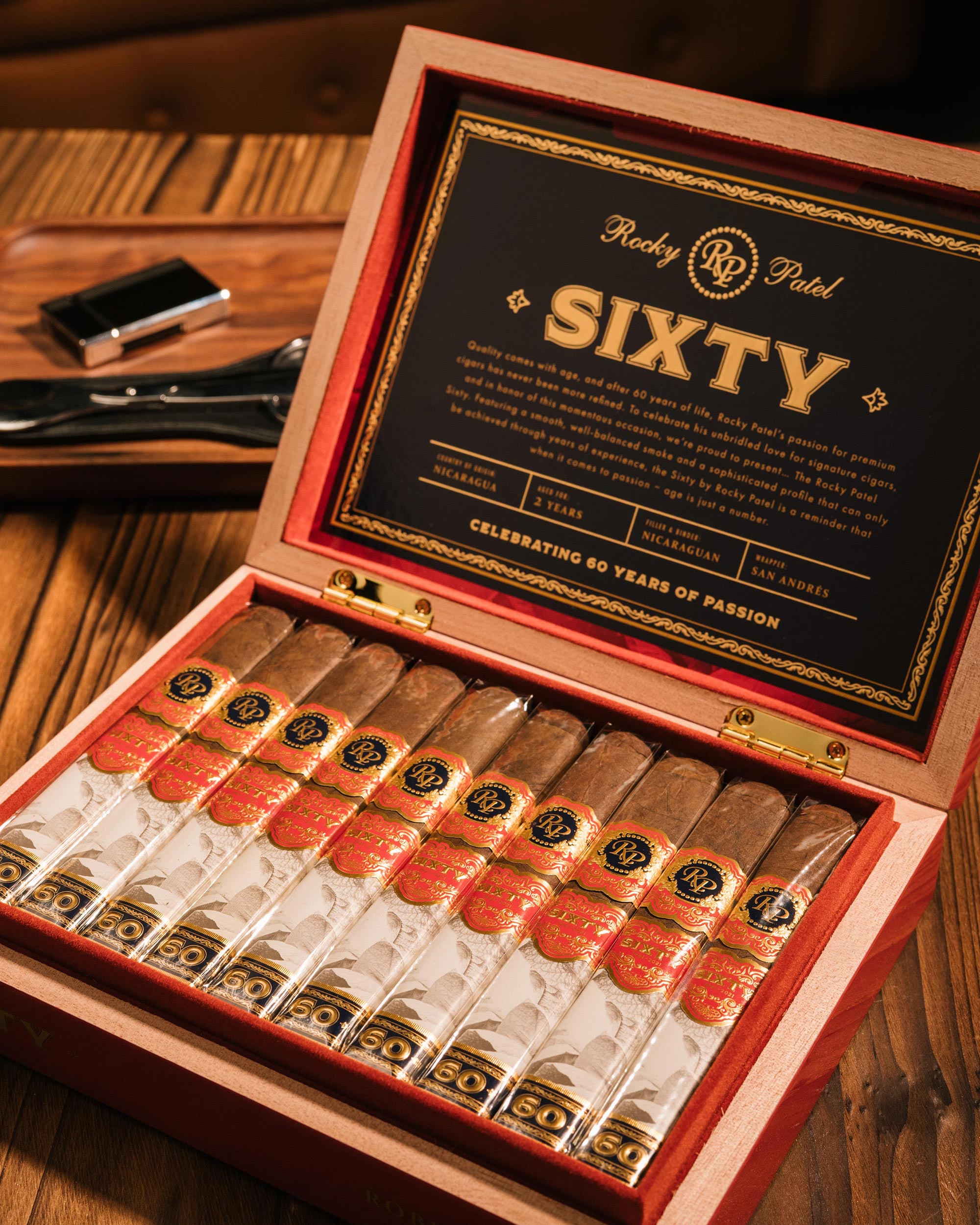 Open humidor with Rocky Patel Sixty cigars on a wooden table