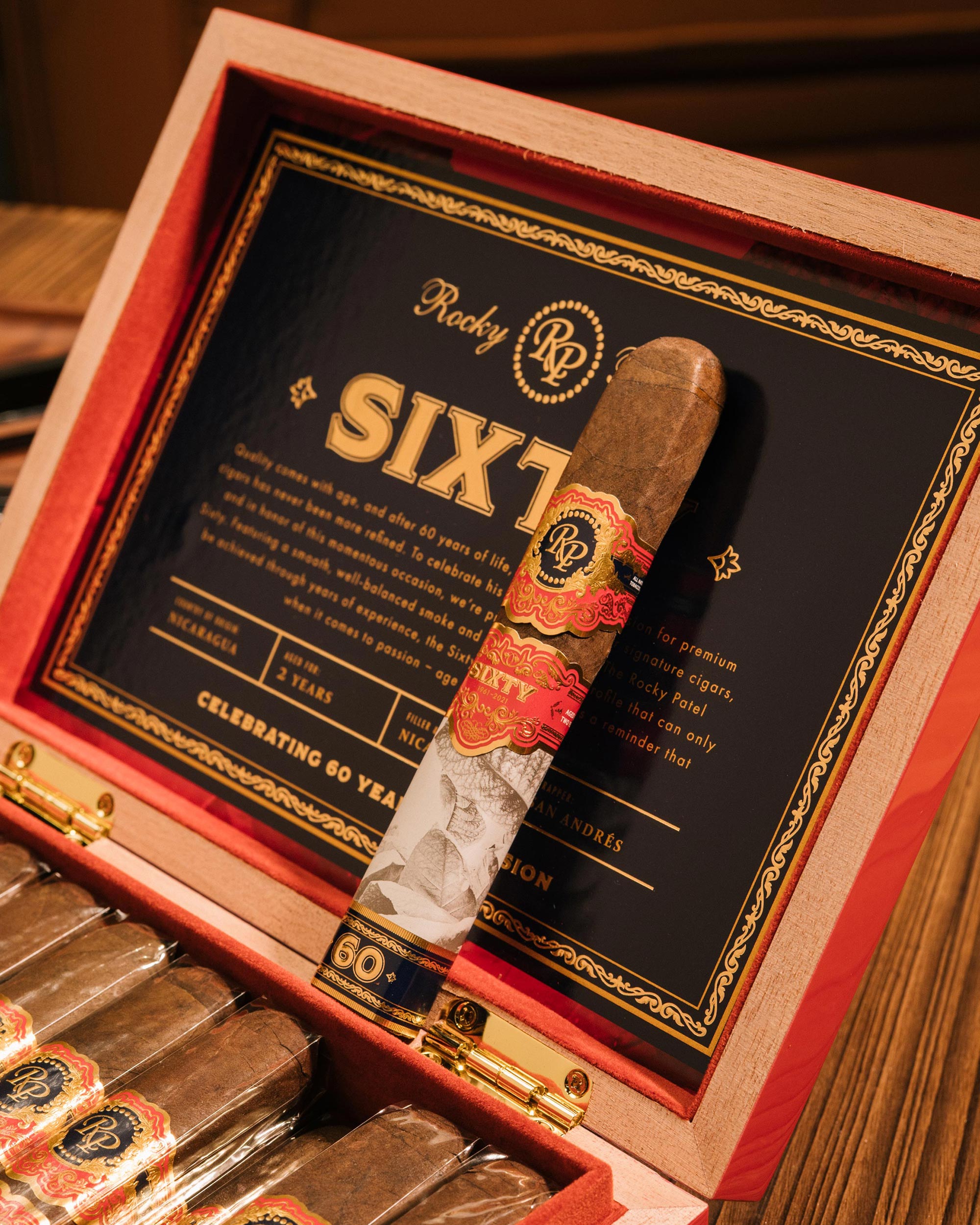 Cigar in a Rocky Patel Sixty box with visible branding
