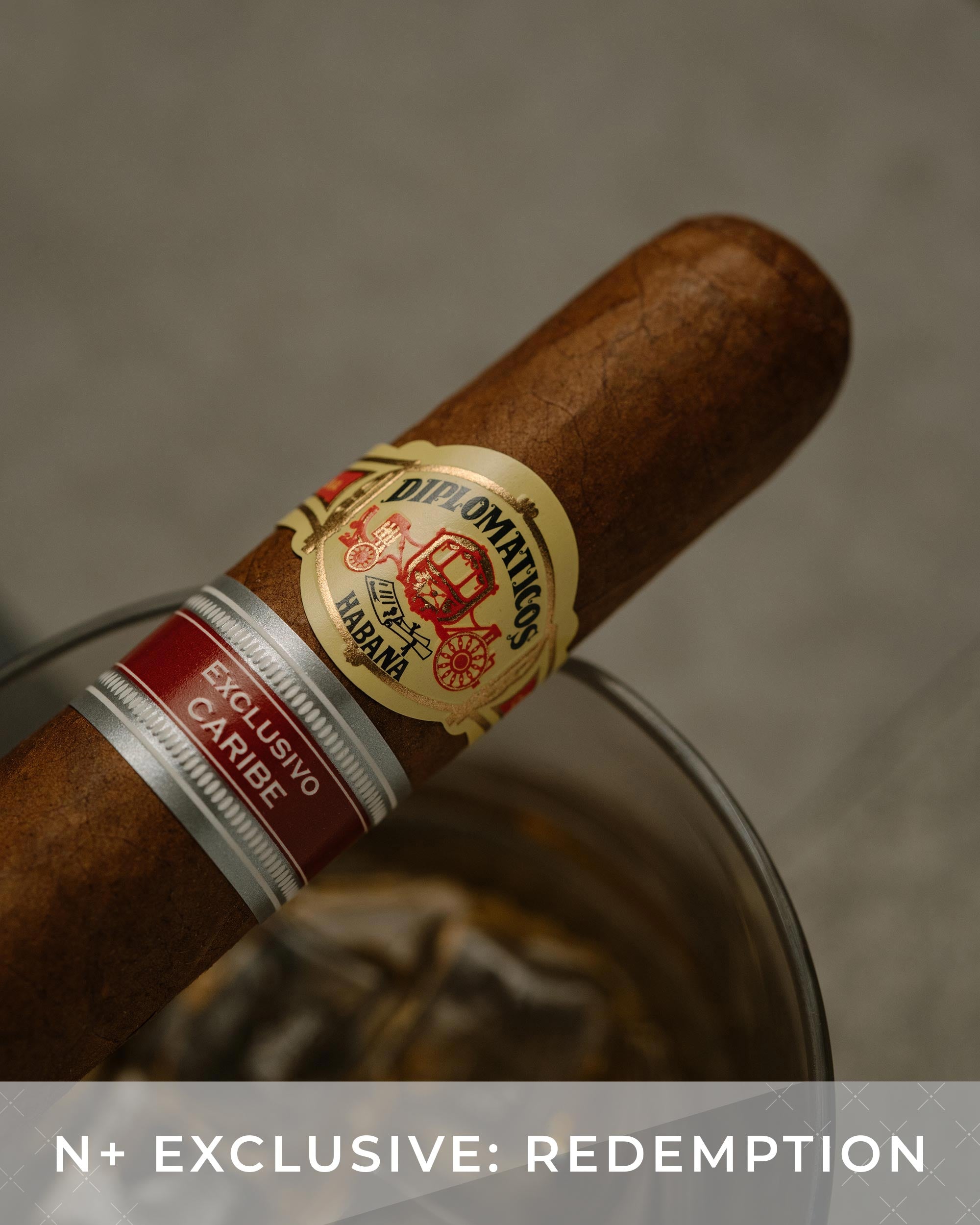 Cigar with a visible label on a neutral background