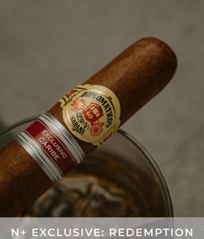 Cigar with a visible label on a neutral background