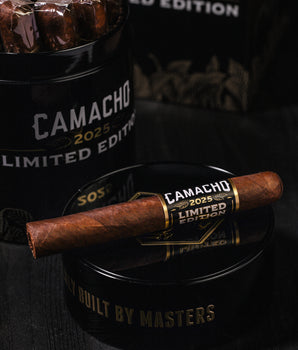 Camacho 2025 Limited Edition cigars with packaging on a dark background