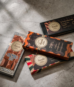 Venchi chocolate bars on a gray surface